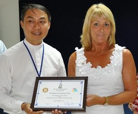 New Sensory Room for the children of Pattaya Pauline Fox receives a certificate of thanks form Father Peter, President of the Father Ray Foundation.